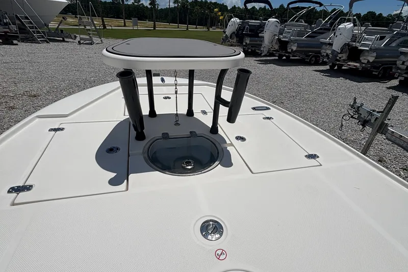 Slide: The Image of 2024 Spyder FX19 Vapor boat deck with rod holders and storage compartments. - 3