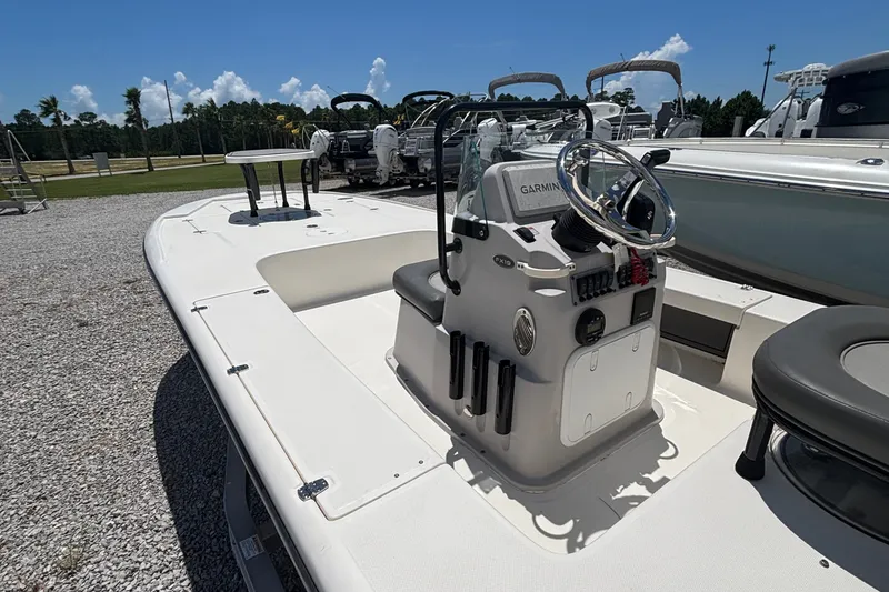 Slide: The Image of 2024 Spyder FX19 Vapor boat with center console and Garmin navigation system. - 1