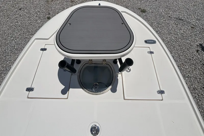 Slide: The Image of 2024 Spyder FX19 Vapor boat deck with storage compartments and rod holders. - 5