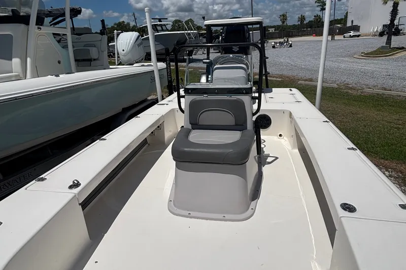 Slide: The Image of 2024 Spyder FX19 Vapor boat with center console and seating, displayed outdoors. - 4