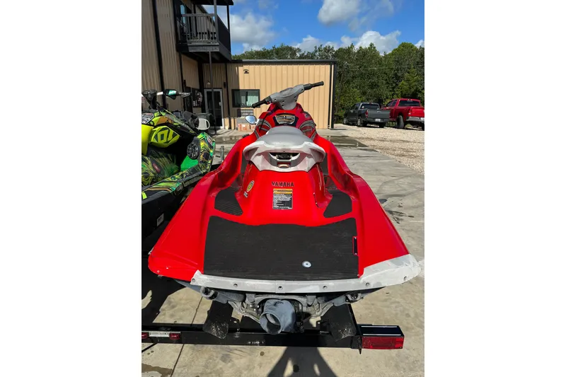 Slide: The Image of Red 2006 Yamaha WaveRunner VX110 Deluxe jet ski parked outdoors. - 6