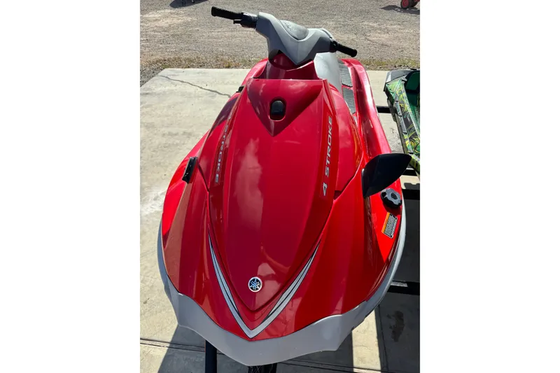 Slide: The Image of 2006 Yamaha WaveRunner VX110 Deluxe, red, parked on concrete surface. - 5