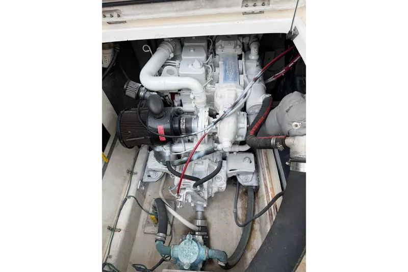 Slide: The Image of Engine compartment of a 1998 Bayliner 3388 Command Bridge Motoryacht, showcasing mechanical components. - 37