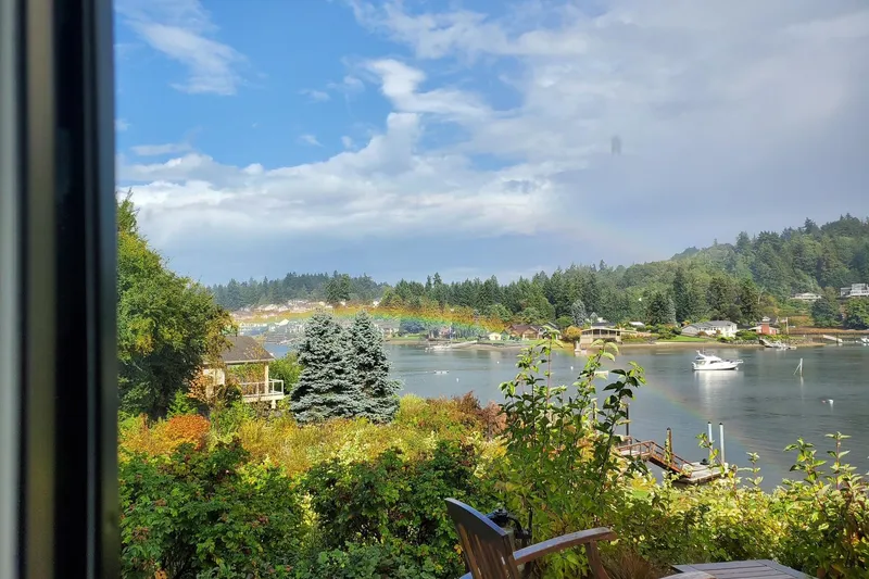 Slide: The Image of Scenic waterfront view with rainbow, featuring a 1998 Bayliner 3388 Command Bridge Motoryacht. - 9
