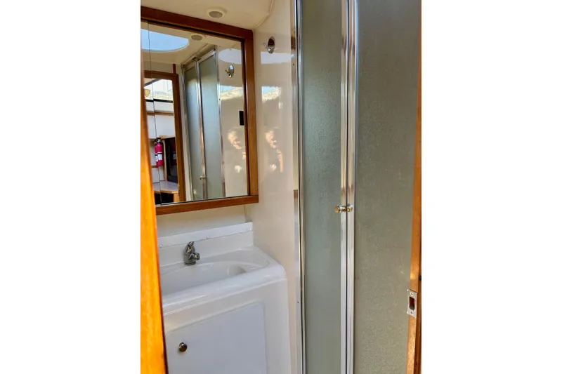 Slide: The Image of Bathroom interior of 1998 Bayliner 3388 Command Bridge Motoryacht with shower and sink. - 32