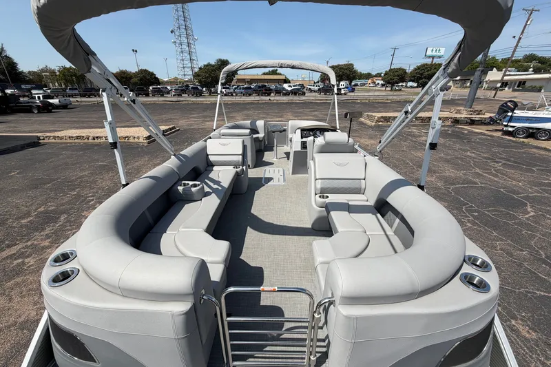 Slide: The Image of 2025 Bennington 22 L Quad Bench pontoon boat with spacious seating and modern design. - 21