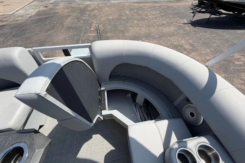 Slide: The Image of The image shows the gray upholstered seating area of a 2025 Bennington 22 L Quad Bench boat. - 18
