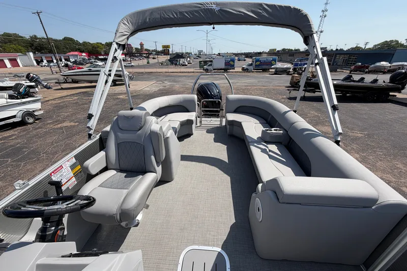 Slide: The Image of 2025 Bennington 22 L Quad Bench pontoon boat with spacious seating and modern design. - 22