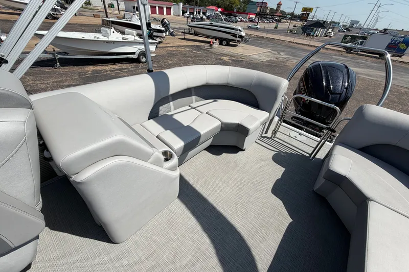 Slide: The Image of 2025 Bennington 22 L Quad Bench boat interior with plush seating and modern design. - 34