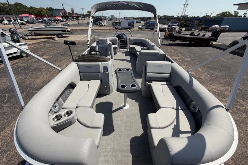 Slide: The Image of 2025 Bennington 22 L Quad Bench pontoon boat with spacious seating and modern design. - 13