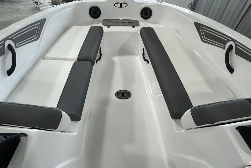 Slide: The Image of 2026 Tahoe T21 boat interior with gray and white seating, sleek design. - 22
