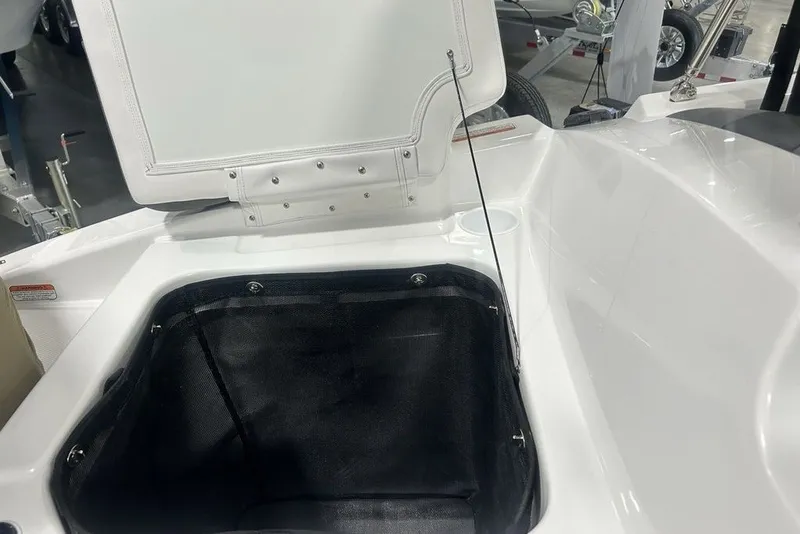 Slide: The Image of Open storage compartment in 2026 Tahoe T21 boat, showcasing interior details and design. - 28