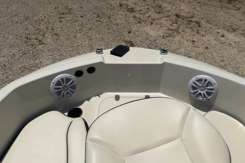 Slide: The Image of 2020 Stingray 182 SC boat interior with speakers and seating. - 11