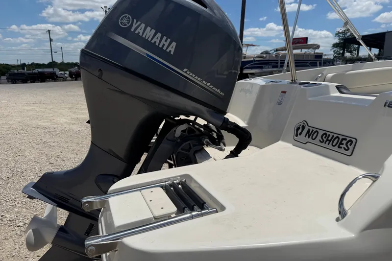 Slide: The Image of 2020 Stingray 182 SC boat with Yamaha outboard motor, "No Shoes" sign visible. - 7