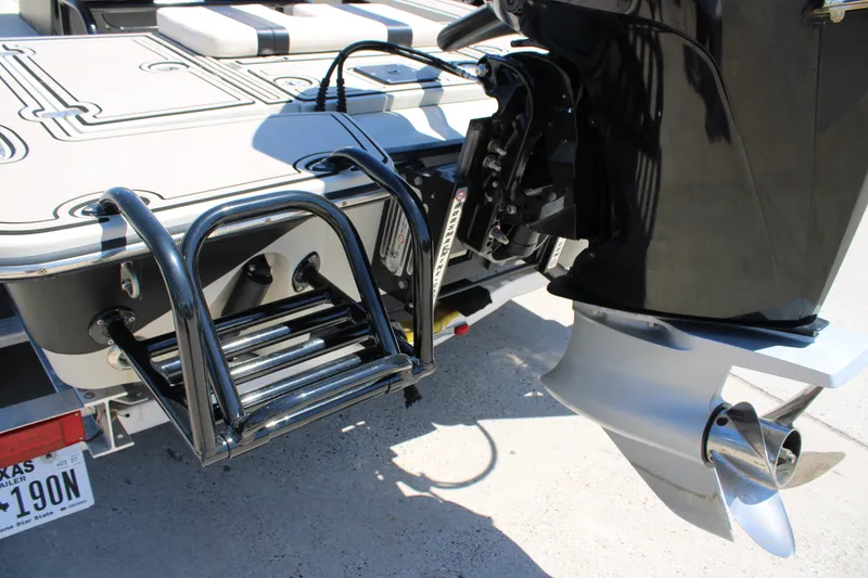 Slide: The Image of 2013 Blazer 675 Ultimate Bay boat with ladder and outboard motor detail. - 20