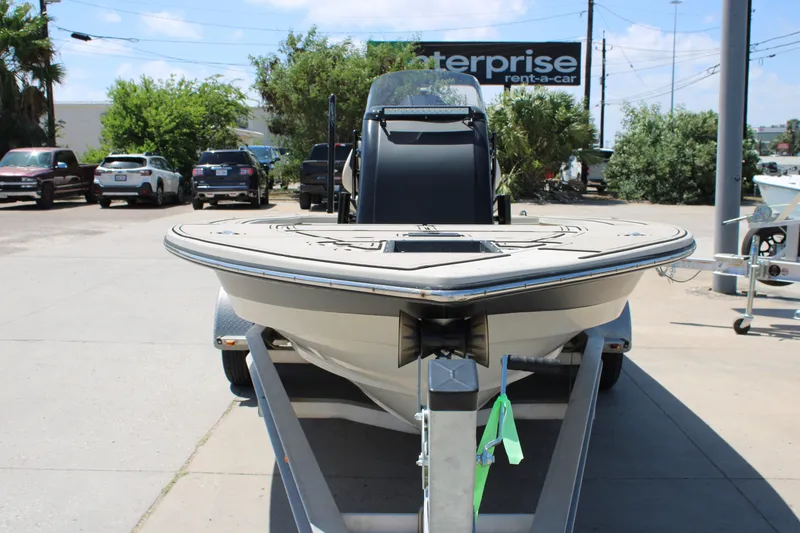 Slide: The Image of 2013 Blazer 675 Ultimate Bay boat on trailer in parking lot. - 16