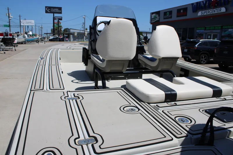 Slide: The Image of 2013 Blazer 675 Ultimate Bay boat with dual seats and sleek deck design. - 21