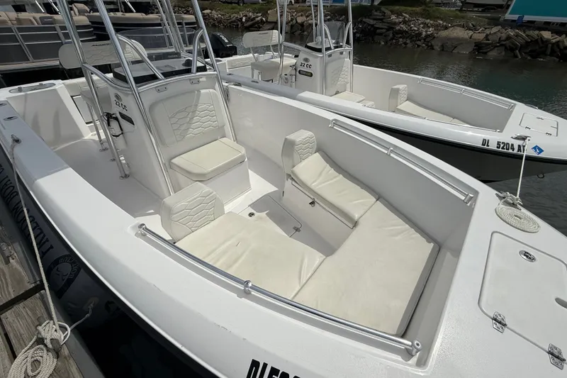 Slide: The Image of 2024 Aquasport 2200 Center Console boat with spacious seating and sleek design. - 5