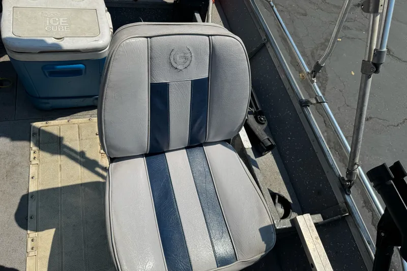 Slide: The Image of Boat interior with gray seat and cooler, Gregor Eagle 16, 1995 model. - 17