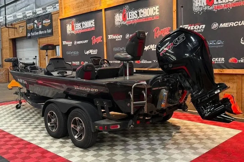 The Image of 2020 Ranger RT188P boat with Mercury engine displayed indoors at Anglers Choice event. - 1