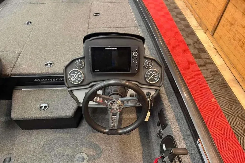 Slide: The Image of 2020 Ranger RT188P boat dashboard with steering wheel and electronic display. - 6