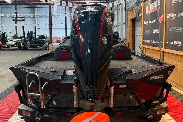 Slide: The Image of 2020 Ranger RT188P boat with powerful outboard motor in showroom setting. - 3