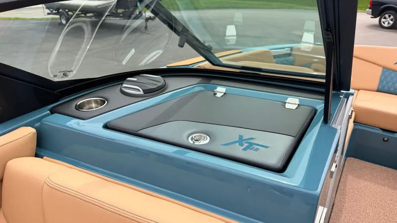 Slide: The Image of The image shows the cockpit of a 2027 MasterCraft XT22 with blue and beige accents. - 48