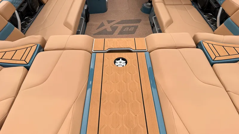 Slide: The Image of The image shows the luxurious interior of a MasterCraft XT22 boat with beige upholstery. - 19