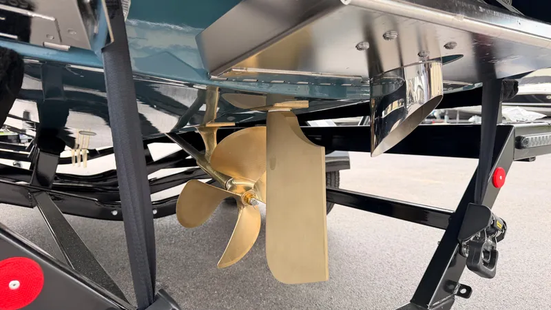 Slide: The Image of Close-up of a boat rudder and propeller beneath a 2027 MasterCraft XT22. - 8