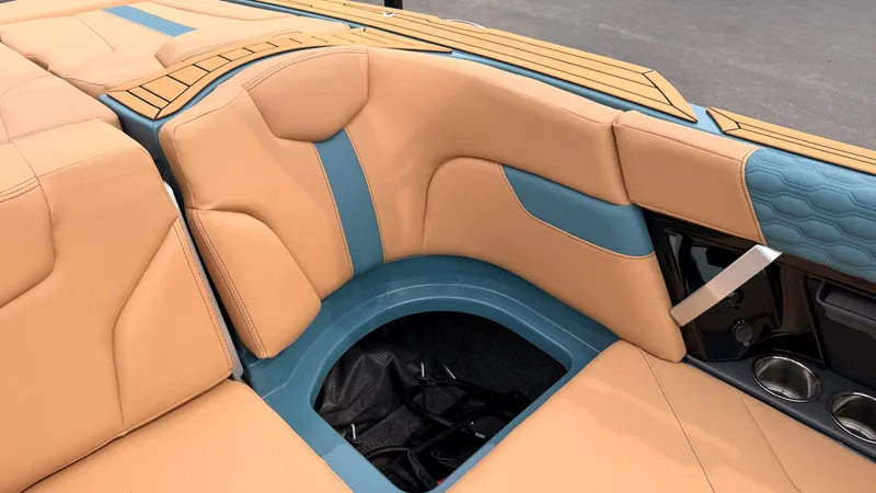 Slide: The Image of The image shows the luxurious interior of a MasterCraft XT22 boat with beige and blue upholstery. - 39