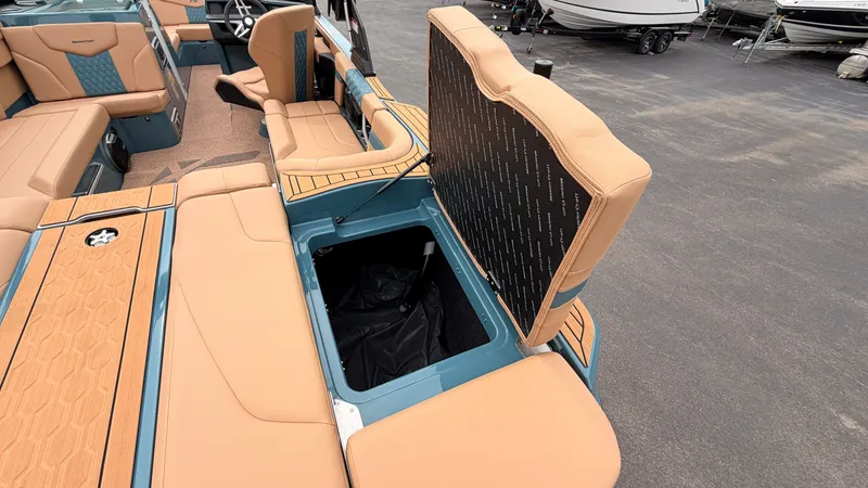 Slide: The Image of The image shows the interior of a 2027 MasterCraft XT22 with an open storage compartment. - 17