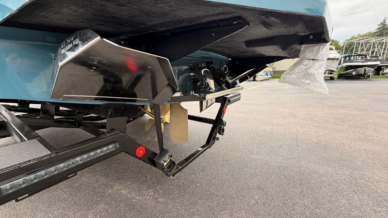 Slide: The Image of The image shows the stern of a 2027 MasterCraft XT22 boat with a propeller and trailer. - 6
