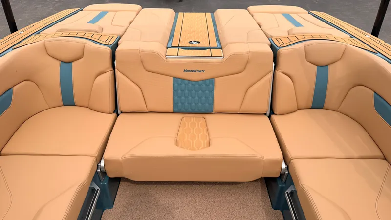 Slide: The Image of The 2027 MasterCraft XT22 features luxurious beige and blue upholstery with a stylish design. - 33