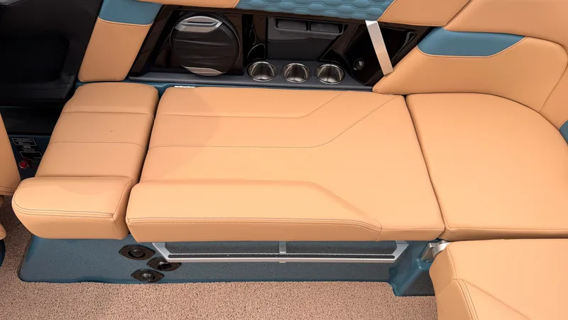 Slide: The Image of The 2027 MasterCraft XT22 features a luxurious beige lounging area with blue accents. - 28