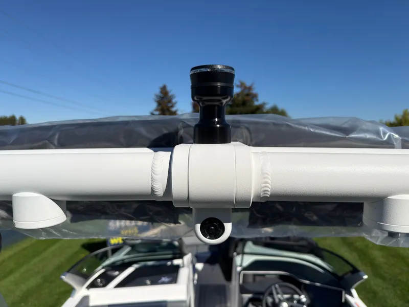 Slide: The Image of Close-up of a white boat pipe with a camera, below is a modern motorboat. - 42