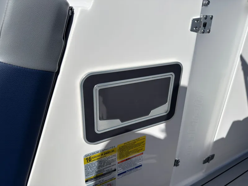 Slide: The Image of Close-up of a boat part with stickers and a small compartment. - 23