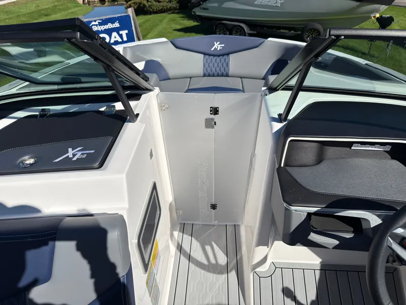 Slide: The Image of The image shows the cockpit of a 2027 MasterCraft XT22 with gray and blue upholstery. - 21
