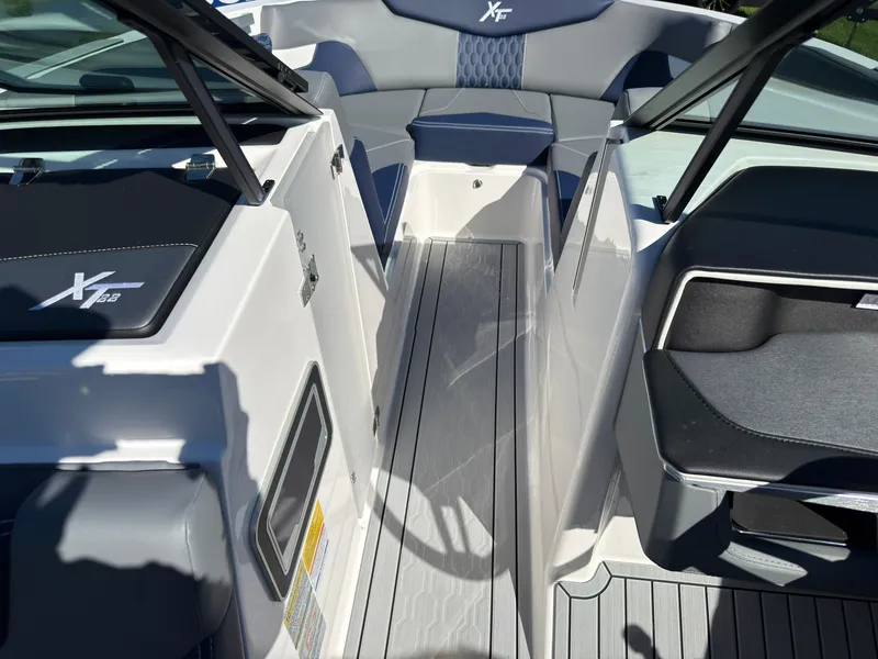 Slide: The Image of The image shows the cockpit of a 2027 MasterCraft XT22 with gray and blue upholstery. - 22