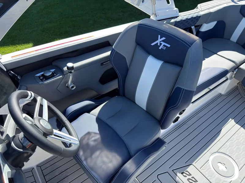 Slide: The Image of The 2027 MasterCraft XT22 features a luxurious driver's seat with modern design and premium materials. - 36