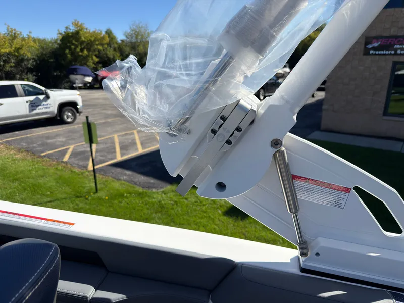 Slide: The Image of Close-up of a boat part with hydraulic arm and plastic cover. - 39