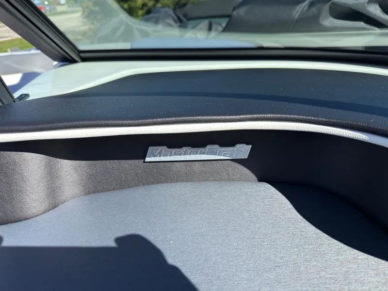 Slide: The Image of Close-up of a 2027 MasterCraft XT22 interior featuring the brand logo. - 32
