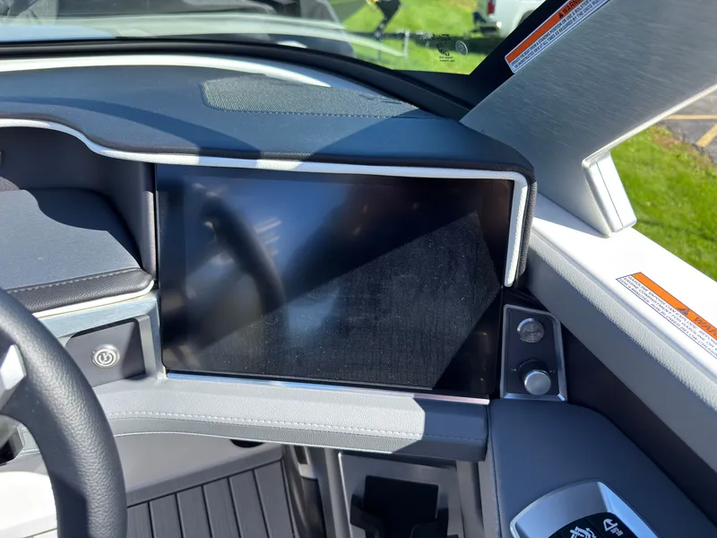 Slide: The Image of The image shows the dashboard of a 2027 MasterCraft XT22 with a large display screen. - 30