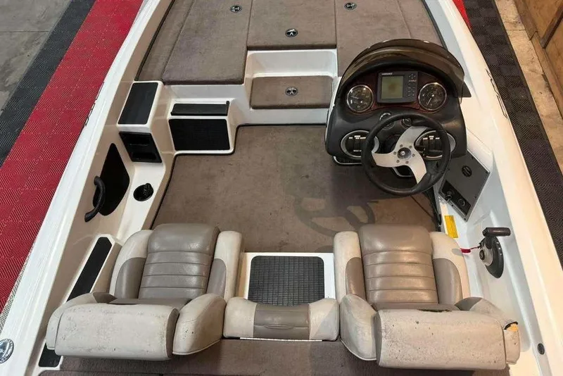 Slide: The Image of 2007 Triton Tr-186 boat interior with dual seats and steering console. - 6