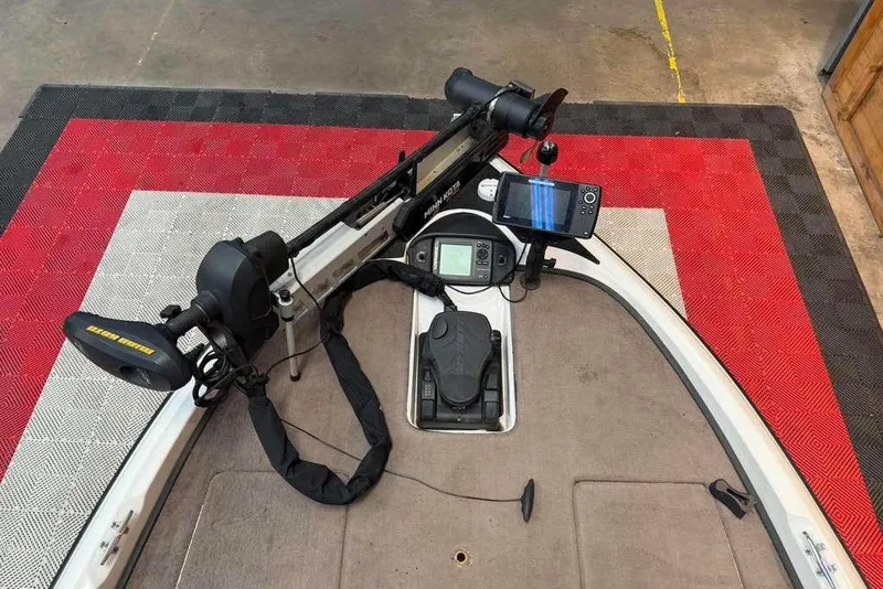 Slide: The Image of 2007 Triton Tr-186 boat deck with trolling motor and fish finder. - 8