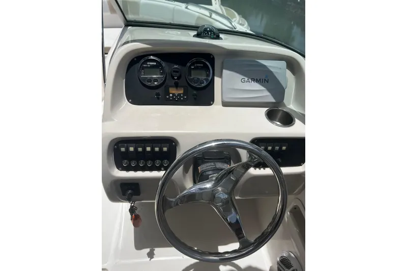 Slide: The Image of 2016 Robalo R227 Dual Console dashboard with Garmin navigation and Yamaha gauges. - 15