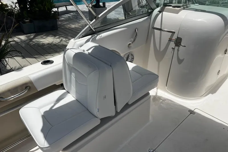 Slide: The Image of 2016 Robalo R227 Dual Console boat interior with white seating and sleek design. - 11