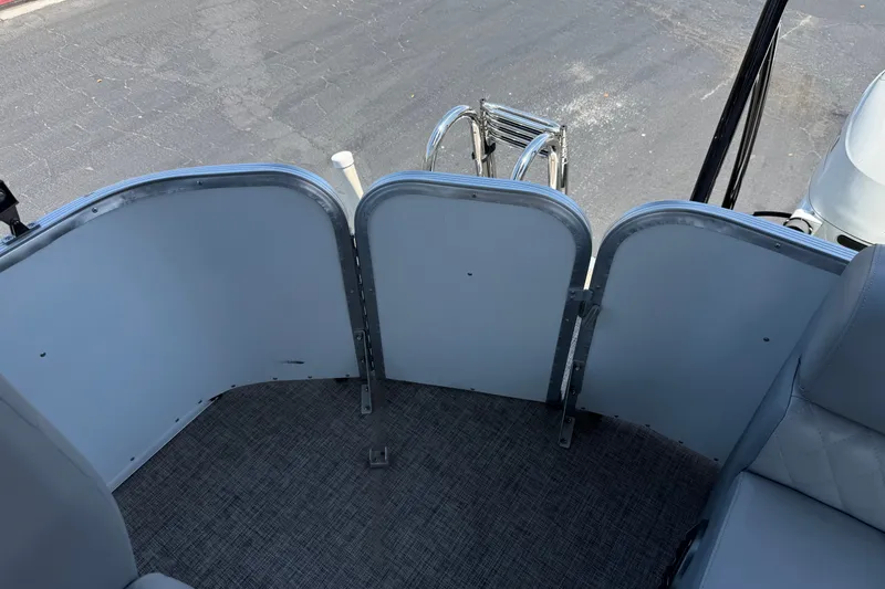 Slide: The Image of 2024 Lexington Emerg 17 Palm Breeze boat interior with ladder and seating. - 17