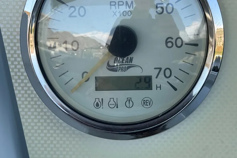 Slide: The Image of Close-up of a 2024 Lexington Emerg 17 Palm Breeze RPM gauge displaying 2.9 hours. - 23