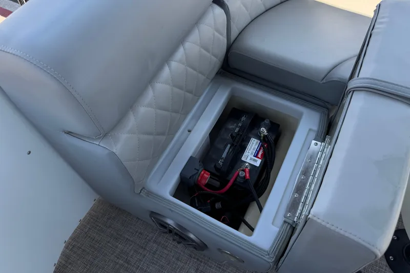 Slide: The Image of 2024 Lexington Emerg 17 Palm Breeze boat seat with battery compartment open. - 16