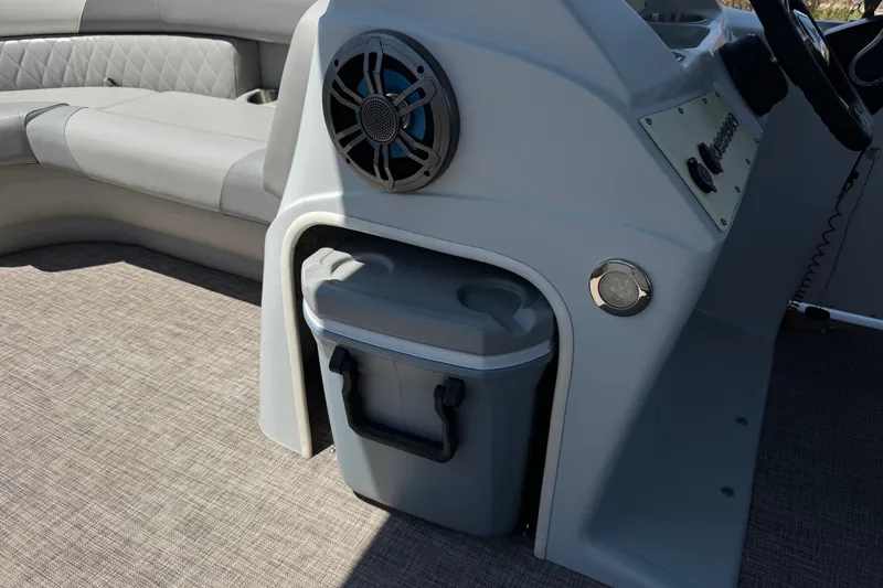 Slide: The Image of 2024 Lexington Emerg 17 Palm Breeze boat interior with speaker and storage compartment. - 22